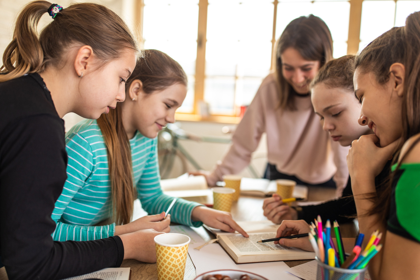 Teacher and students solving Math problems together